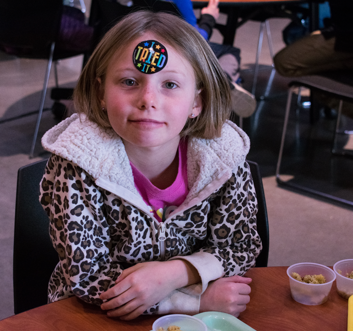 Bella Cohen proudly displays her participation in the event by placing an ‘I tried it!’ sticker on her forehead.